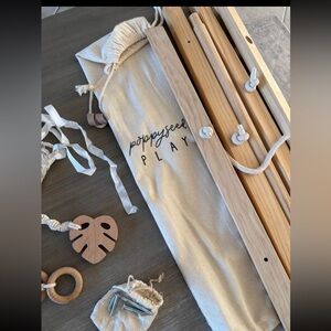 Poppyseed Play wooden play gym  with macrame hanging toys ✨